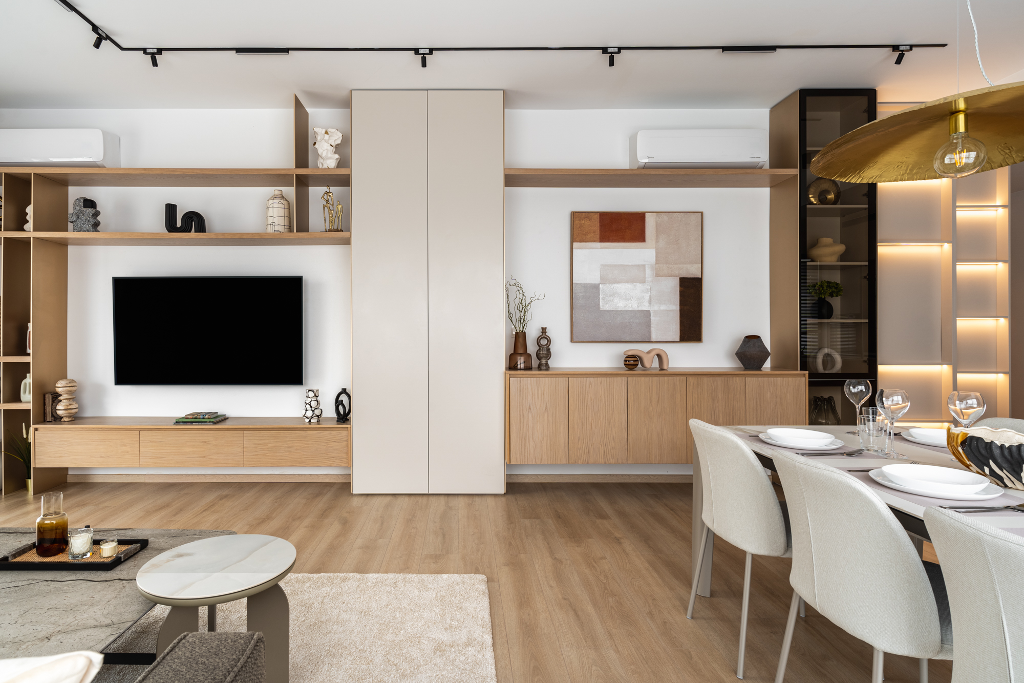 Full length media and display wall in oak with concealed storage